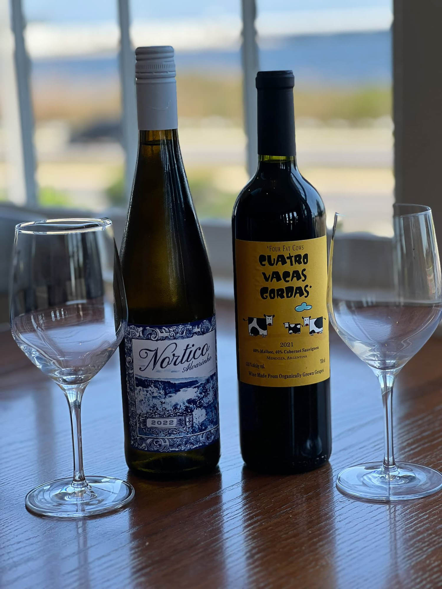 White wine selection, bottles with glasses