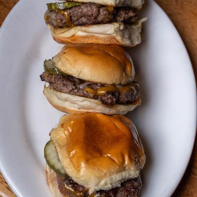 Three cheeseburger sliders.