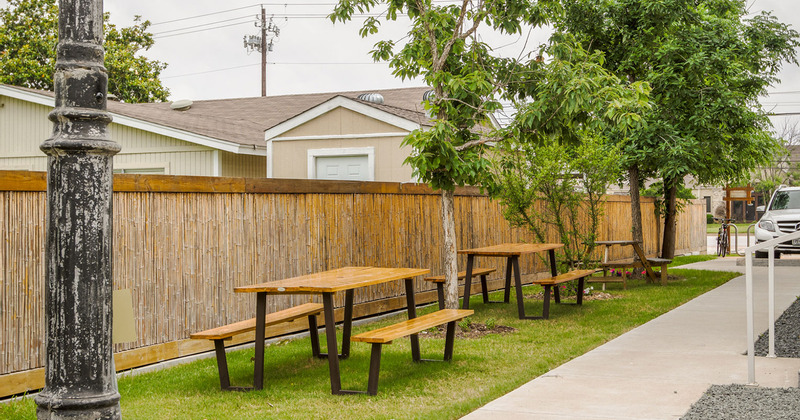 Outdoor seating area, conjoined tables and benches