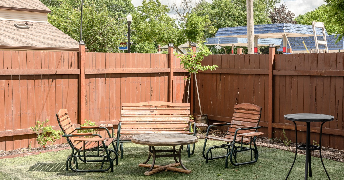 Exyerior, patio bar, stools, drink rack behind