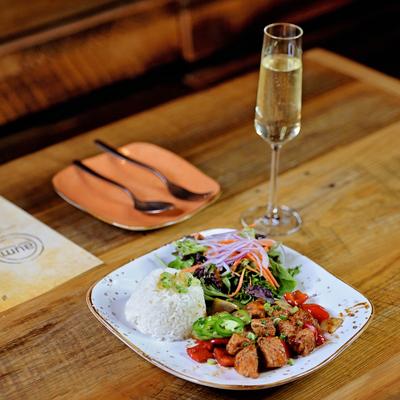 Shake That Salmon dish served with a sparkling wine flute.