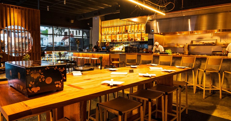 Interior, dining area and the bar in the back