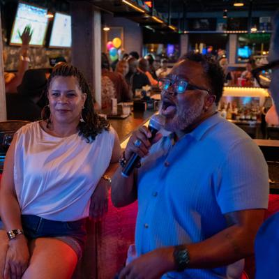 Customer singing karaoke.