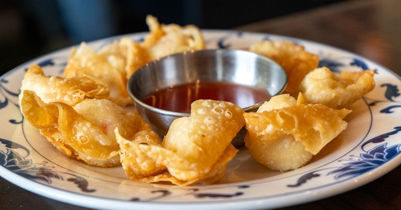 Crab Rangoon served with a dipping sauce