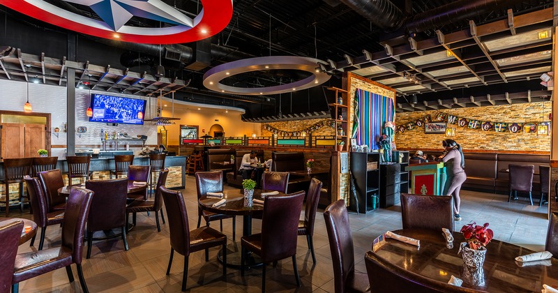Cozy interior dining area with dining tables ready for guests