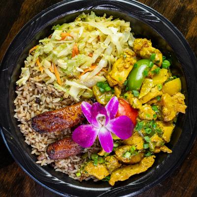 Chicken Curry, served with rice, peas, and cabbage,  top view.