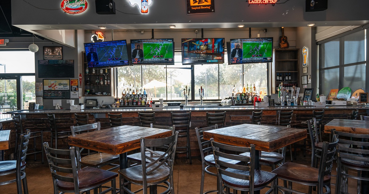 Interior space, seating area and bar with indoor and outdoor seating