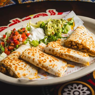 Quesadilla served with pico de gallo, sour cream, and guacamole.