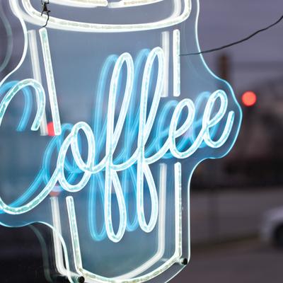 Neon coffee sing, close-up.