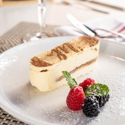 Tiramisu with berries on the side.