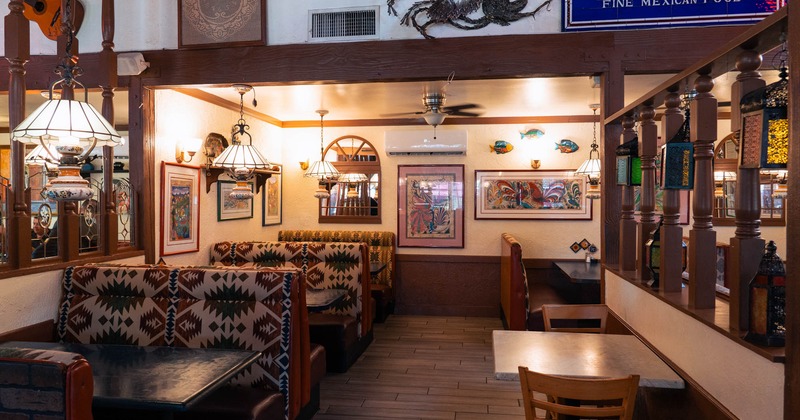 Interior, dining area, seating booths with tables, marbletop table for two, chandeliers