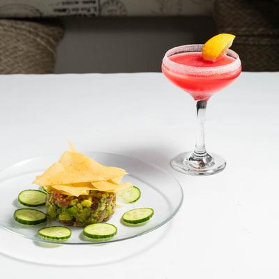 Tuna tartare accompanied with Raspberry Martini.