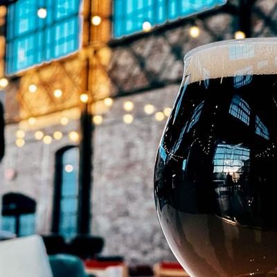 A glass of dark beer, closeup.