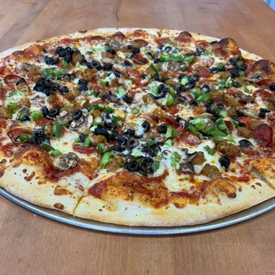 Pizza topped with pepperoni, green peppers  mushrooms, and black olives.