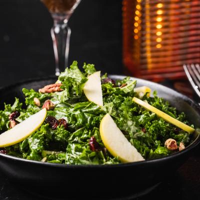 Kale, dried cranberries, pecans, green apple, red apple, pumpkin seeds, tahini fox dressing.