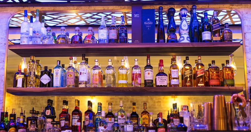 Bar shelves with bottles of spirits