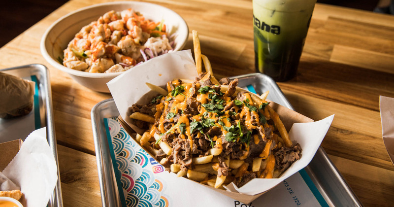 Grilled sliced meat with fries and decorations