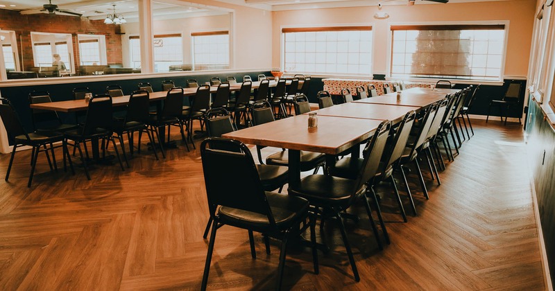 Main dining area with tables and chairs ready for guests