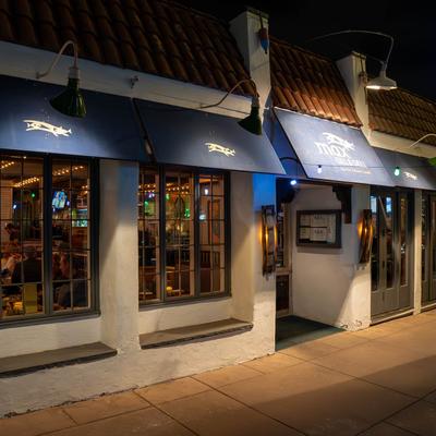 exterior photo of our building at night..