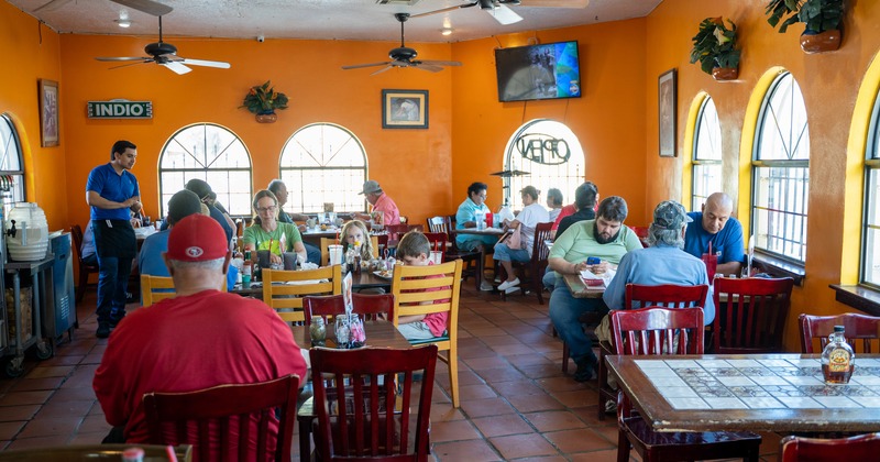 Interior, diner area, tables, chairs, people