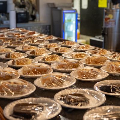 Table with slices of chocolate cake and apple pie.