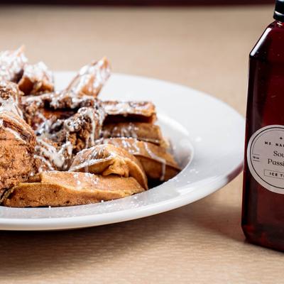 Sweet potato waffles and crispy fried chicken wings.