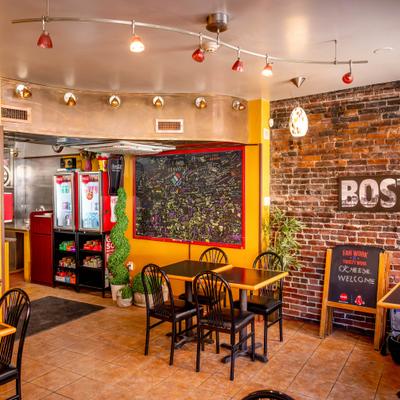 Restaurant interior with tables and wall decor.