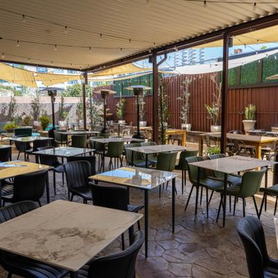 Outdoor covered patio, seating area.