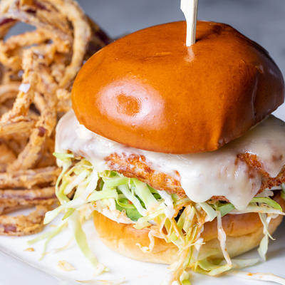 Burger with lettuce and curly fries