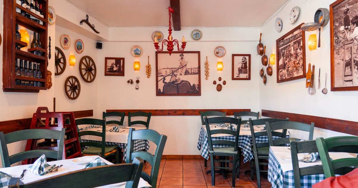 Interior seating area with chairs and tables, rustic Italian decoration