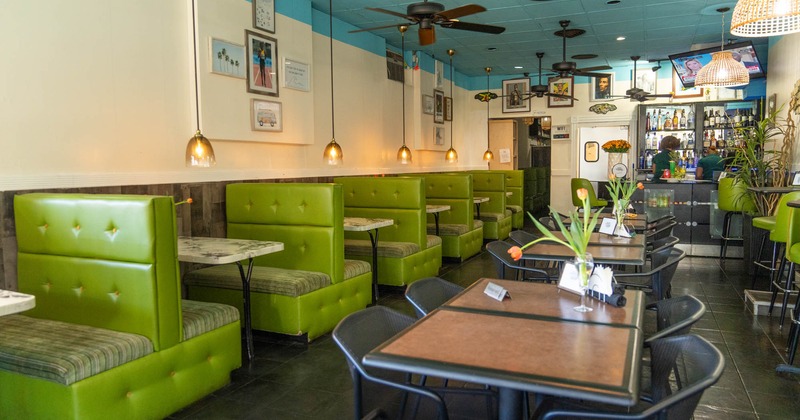 Interior, tables and chairs, booth area on the left