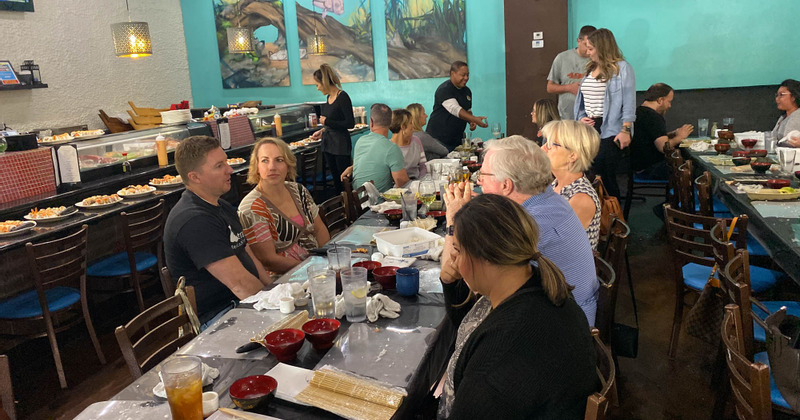 crowd at the table posing