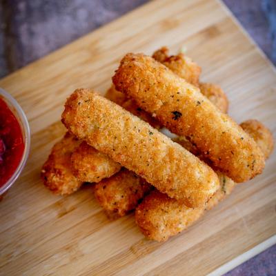 Mozzarella sticks served with marinara sauce.