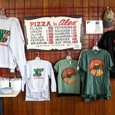 Merchandise area, T-shirts hanging on a wall