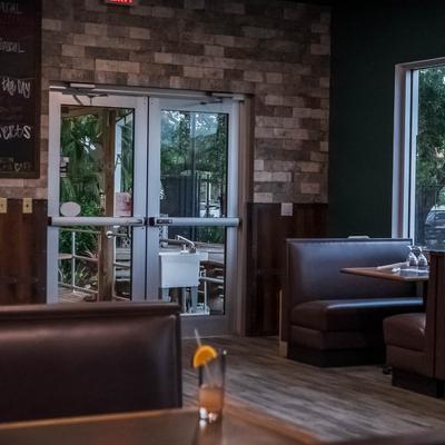 Interior, dining area with boots and tables.