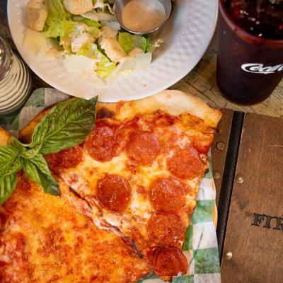 Pepperoni Pizza and Cheese Pizza slices, served with Caesar Salad.