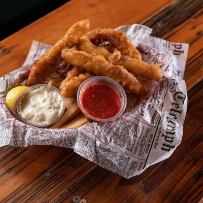 Fried Cod and fries with dipping sauces.