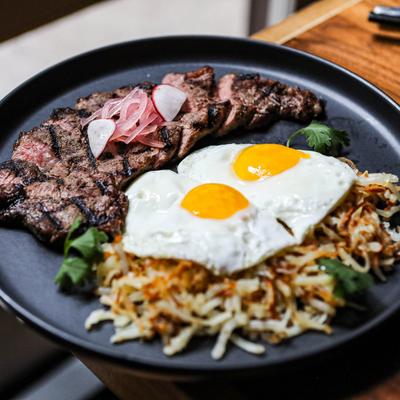 Steak and eggs with hash browns.