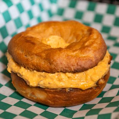 Gluten Free Bagel with bacon honey Siracha cream cheese.