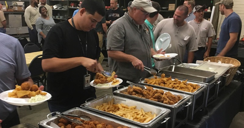 Interior, people helping themselves to food