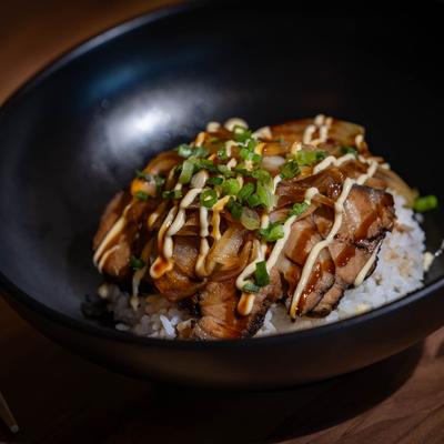 Pork belly bowl with onions, rice, and Japanese mayo.