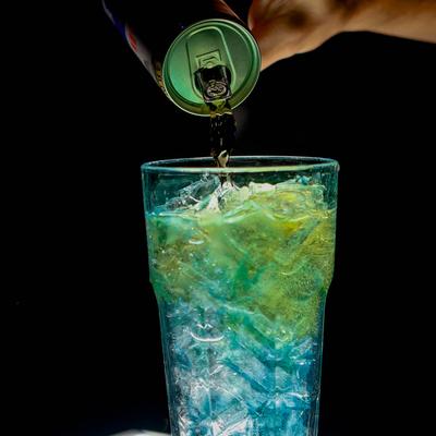 Bartender pouring a cocktail.