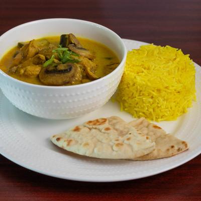 Chicken curry, served with rice and pita.
