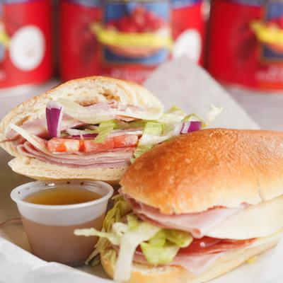 Italian sub sandwich served with a dressing on the side.