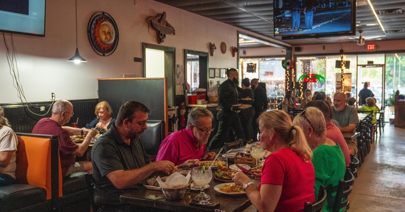 Interior, dining area, guests enjoying their food and drinks