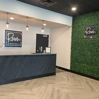 The bar and greenery wall in The Room @Mattingly's.