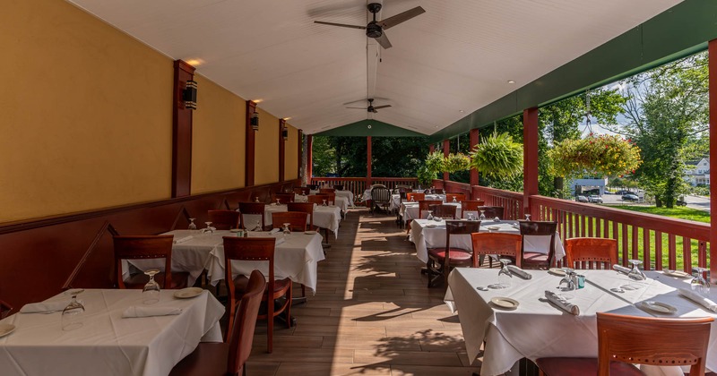 Exterior, covered terrace, fully set tables