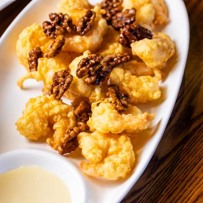 Honey walnut shrimp with a sauce on the side.
