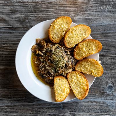 Sauteed mushrooms with toasted bread, top view.