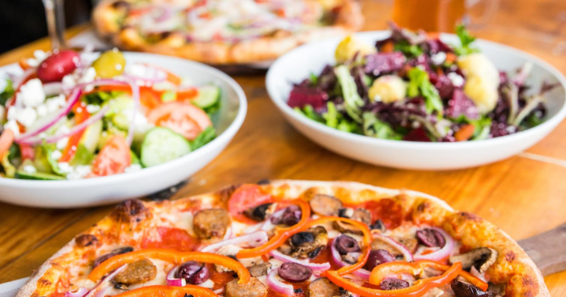 Pizza Americana and different salads